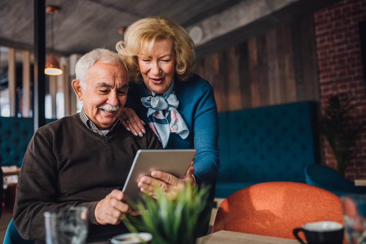 Old people looking at digital tablet